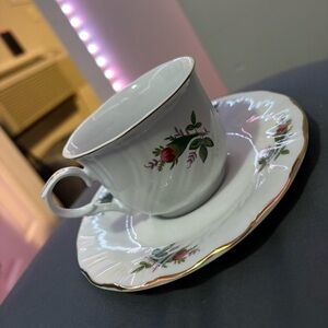 White with gold colored rim fine china rose design vintage teacup and saucer
